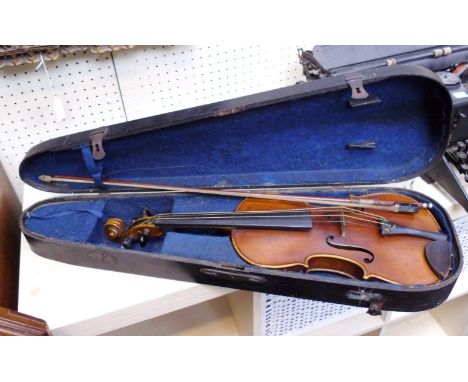 An early 20th century full size violin and bow, in shaped wooden case, the violin with ebony furniture and two part back, tog