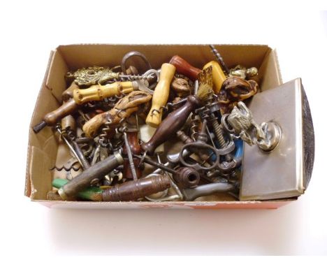 A collection of vintage and antique corkscrews, including concertina action mahogany pulls with badger brush and others