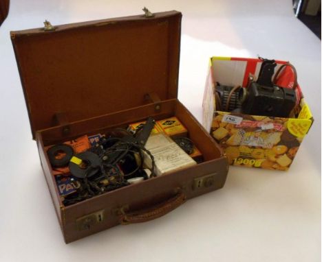 A Pathescope kid film projector, and various film reels