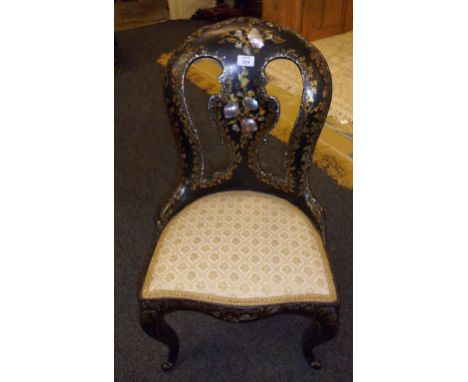 A Victorian Jennens and Bettridge type mother of pearl inlaid spoon back low chair, with parcel gilt decoration, raised on sp