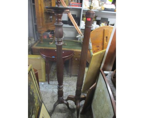 Two early 20th century mahogany torchere stands, together with a mahogany standard lamp and a pole screenLocation: G 