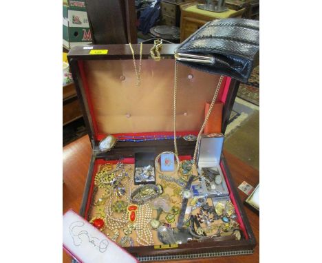 A mahogany box containing vintage costume jewellery and ladies watches to include gold plated items, vintage paste brooches a