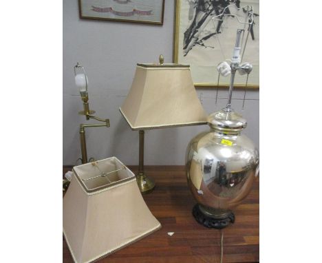 Two adjustable brushed brass table lamps with shades together with a contemporary bulbous and chrome coloured table lamp 