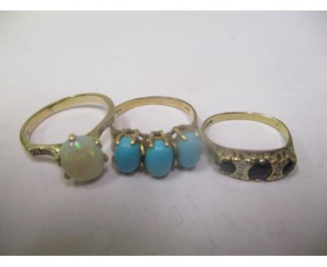 Three 9ct gold rings to include a turquoise ring, opal ring and a sapphire and diamond ring, 6.9 grams 