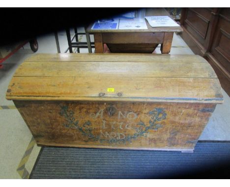 An antique pine domed trunk with painted decoration and date 1776, with iron carrying handles and key 24" x 48 3/4" x 22 5/8"