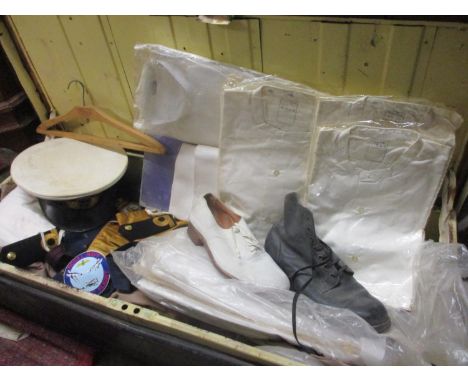 A vintage trunk containing a collection of mid 20th century Royal Navy uniform and accessoriesLocation: RAF 