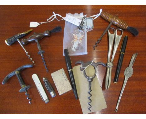 A selection of early to mid 20th century corkscrews, a novelty key ring, mixed silver plate and a quantity of vintage pens to