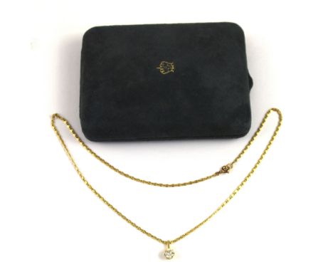 An 18ct gold mounted sixty-three point diamond solitaire pendant on fancy link chain, approx 5g.