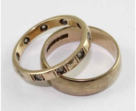 A 9ct gold ladies' wedding band, size J and a 9ct gold eternity ring set with small white stones, size K, combined approx 4.4