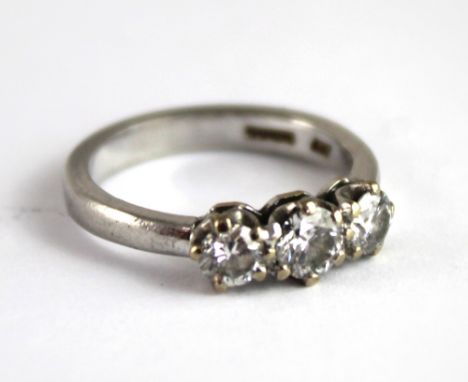 An 18ct white gold three stone diamond ring with approx sixty points of diamonds, size J, approx 5g.