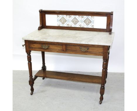 A Victorian red walnut tile-back marble-topped wash stand with two frieze drawers, supported on turned tapering legs to porce