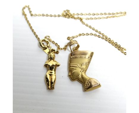 A yellow metal pharaoh pendant, a yellow metal link chain with small female figure pendant, approx combined 5.3g (2).