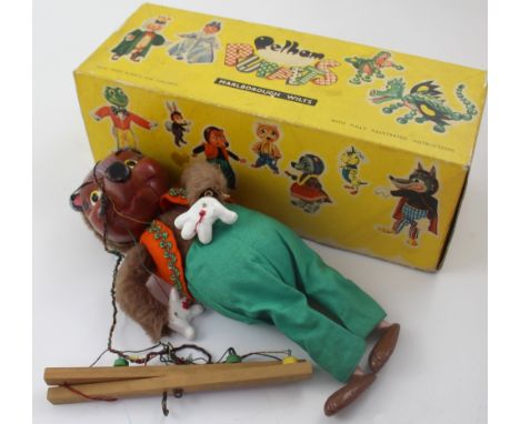 A boxed Pelham Puppet of 'The Wolf' in orange top and green trousers, height approx 30cm. CONDITION REPORT Some slight knocks