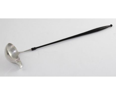 A Georgian silver bowl ladle with turned ebonised handle, marks rubbed.