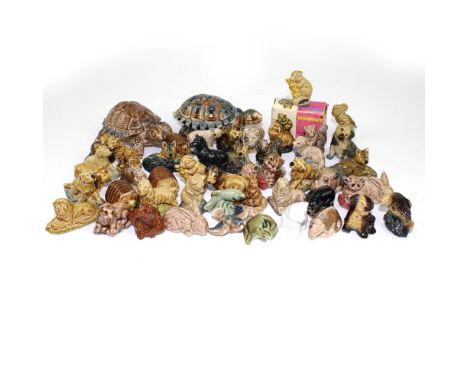 A vintage box containing a quantity of Wade animal figures.