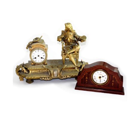 An early/mid-20th century French-style metal gilded eight-day mantel clock, the dial set with Roman numerals, on a stepped ba