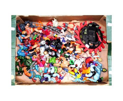 A quantity of He-Man figures and a quantity of wrestling figures, some by Mattel, some dated 1981, 1983 and 1985.