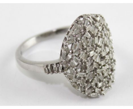 A silver pave-set white stone dress ring marked '925' to the shank, size T, approx 4.5g.