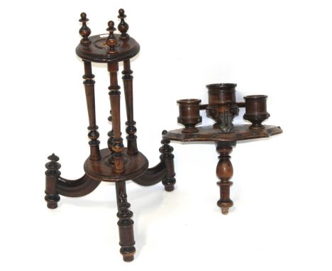 A late 19th/early 20th century mahogany turned smokers' stand, top shelf containing various treen tobacco pots and horseshoe-