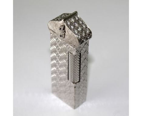 A bespoke Dunhill 18ct white gold and diamond cigarette lighter in the form of a minaret with onion dome flip-top set with th