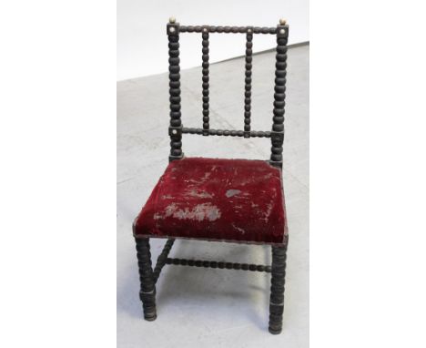 A Victorian mahogany bobbin chair with ivory finials to the back rail and a 19th century provincial oak stained ladder-back c