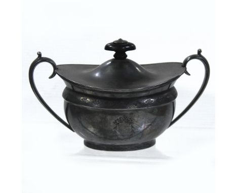 A sterling silver boat-shaped lidded sucrier with ebony knop and loop handles, marked 'Sterling' to the base, Barker Brothers