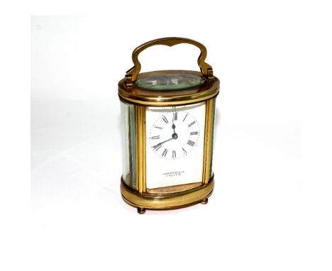 A brass-cased Garrard &amp; Co Ltd mantel clock, the dial set with Roman numerals, in original box.