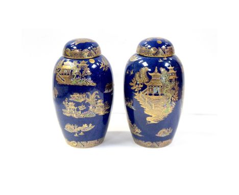 A pair of modern Carltonware blue ground ginger jars with lids, in the Pagoda pattern, height approx 23.5cm (2).