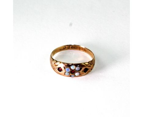 An Edwardian 9ct gold ladies' dress ring, floral-set with opals and rubies, size Q, approx 3g.