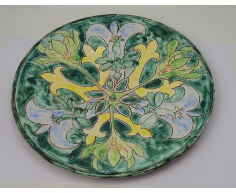 A Della Robbia style plate signed Jane Farbar 1995 to base, diameter 24cm. CONDITION REPORT There are no obvious signs of dam