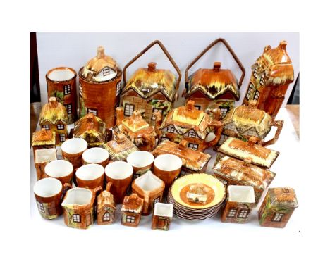 A quantity of cottage ware to include teapots, cups, saucers, biscuit barrel, salt and pepper shakers etc.