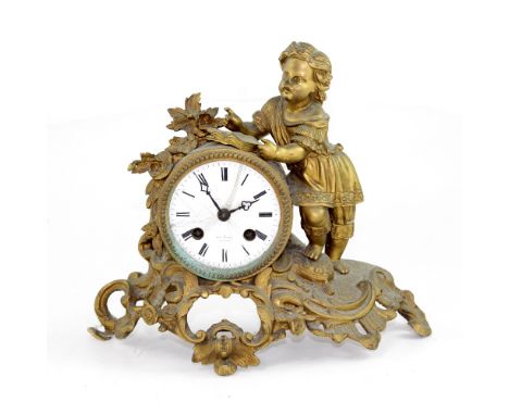 Henry Marc; a French gilded ornate eight-day mantel clock, the white dial set with Arabic numerals on a scrolling floral base