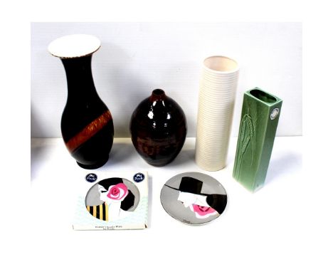 A small collection of mid-20th century pottery vases and plates to include a Dartmouth ribbed sleeve vase, height 26cm, a Kin