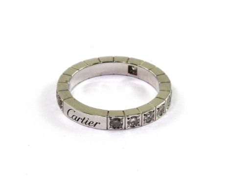 A 14ct white gold and diamond Cartier eternity ring set with eighteen natural diamonds, 0.90ct tdw, size L.