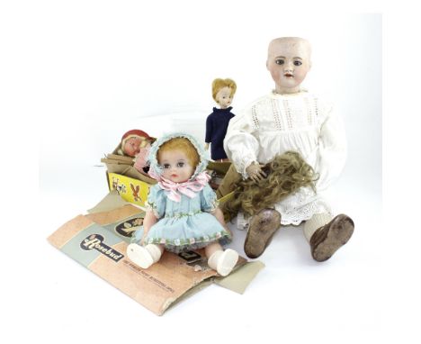 A vintage c1960s 'Rosebud' doll in box, a boxed Pelham Puppet (af) and an early 20th century French bisque head doll with ope