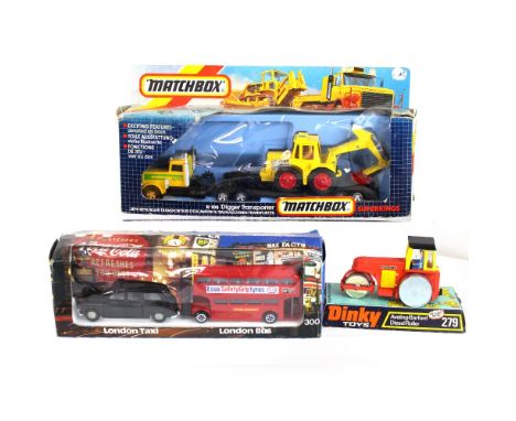 A boxed Dinky diecast model vehicle, 'London Scene 300', a Matchbox 'K-108 Digger Transporter' and a Dinky 'Aveling-Barford D