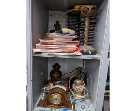 A mixed lot to include an Art Deco oak cased 8-day mantel clock, CD's, table lamps (need rewiring), magazines and other items