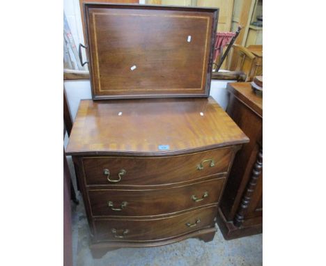 A reproduction serpentine fronted chest of three drawers on bracket feet 76cm x 69.5cm x 46cm, along with an Edwardian inlaid