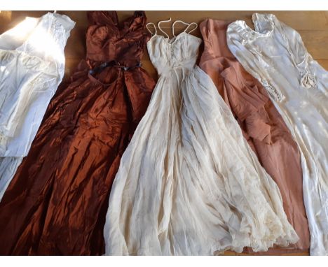 Four early to mid 20th Century ladies gowns to include a Marshall & Snelgrove taffeta silk full length gown in copper with ma