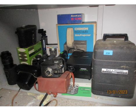 A mixed lot of vintage film cameras, binoculars and a cine projector and slide projectors to include a Praktica Super TL2 cam