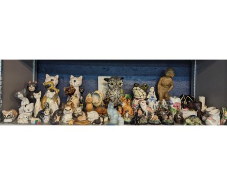 A quantity of model animals, Lladro cat and others, Tiffany style garden ornaments of an Owl and Frog, and other ceramic orna
