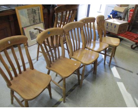 A set of six Windsor kitchen chairs including a high back armchair, slat backs, ring turned legs united by H-stretchers Locat