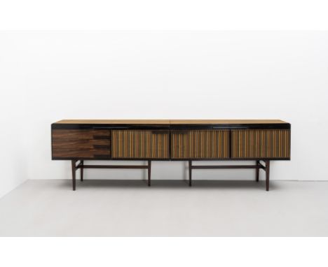 David PowellUnique 'Heal's' two-part sideboard, designed 1964Brazilian rosewood, ebony, fabric upholstered doors. 84 x 220 x 