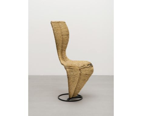 Tom DixonEarly and rare 'S' chair, circa 1988Steel, rush upholstery.108.5 x 44.5 x 49 cmProduced by Tom Dixon, London, United