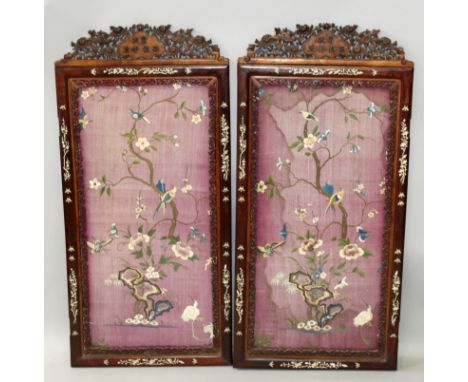 A FINE PAIR OF 19TH/20TH CENTURY CHINESE PURPLE GROUND EMBROIDERED SILK PANELS, circa 1900, in well carved ivory inlaid frame