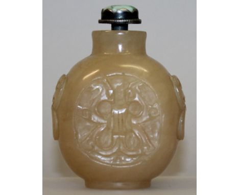 A 19TH/20TH CENTURY CHINESE JADE SNUFF BOTTLE & STOPPER, the sides carved with archaic panels, the apple-green jade stopper w