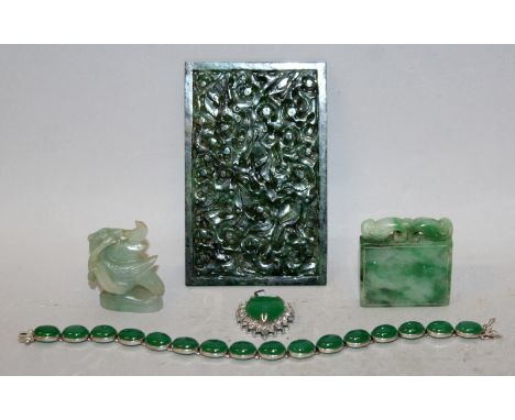 A CHINESE PIERCED SPINACH JADE RECTANGULAR PLAQUE, 3.4in x 2.2in; together with four other jade and jadeite pieces. (5)