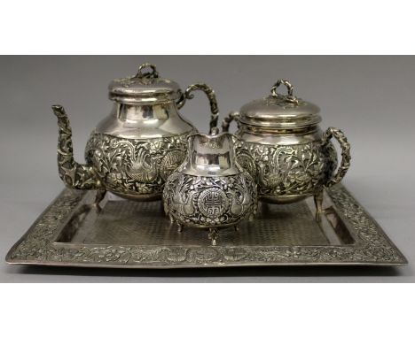 A FINE QUALITY CHINESE SILVER TEA SERVICE, weighing 2.44Kg, comprising a teapot with hinged cover, a sugar basin and cover, a