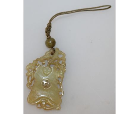 A GOOD 19TH/20TH CENTURY CHINESE PIERCED JADE PENDANT, in the form of a fan overlaid with a ruyi sceptre, with attached hards