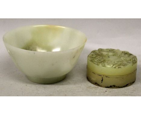 A CHINESE CELADON JADE BOWL, with lighter and darker inclusions, 3.75in diameter & 2in high; together with a jade-like box an